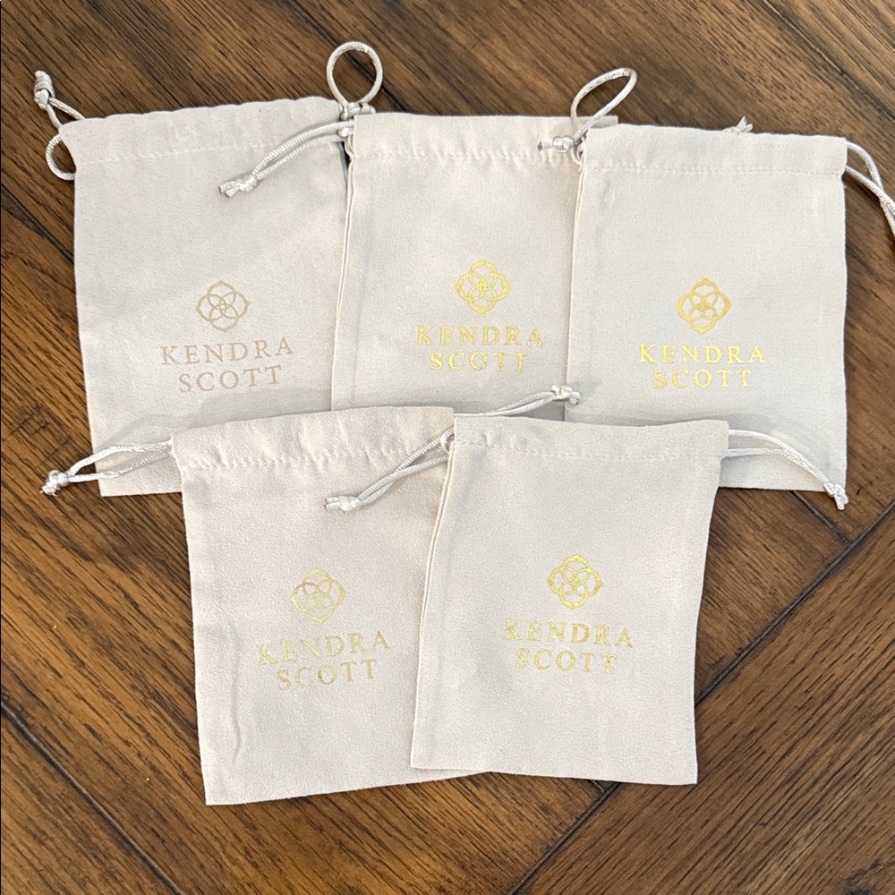 Kendra Scott Cream Pouches with Gold Logo